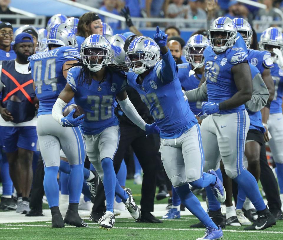 Detroit Lions cornerback Steven Gilmore (36) celebrates with Saivion Smith (23) after intercepting a pass by Jacksonville Jaguars quarterback C.J. Beathard (3) during first half Saturday, August 19, 2023.