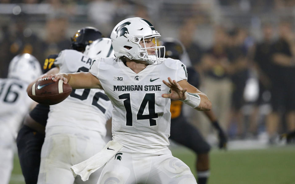 Michigan State quarterback Brian Lewerke throws a pass against Arizona State during the second half of an NCAA college football game Saturday, Sept. 8, 2018, in Tempe, Ariz. Arizona State defeated Michigan State 16-13. (AP Photo/Ross D. Franklin)