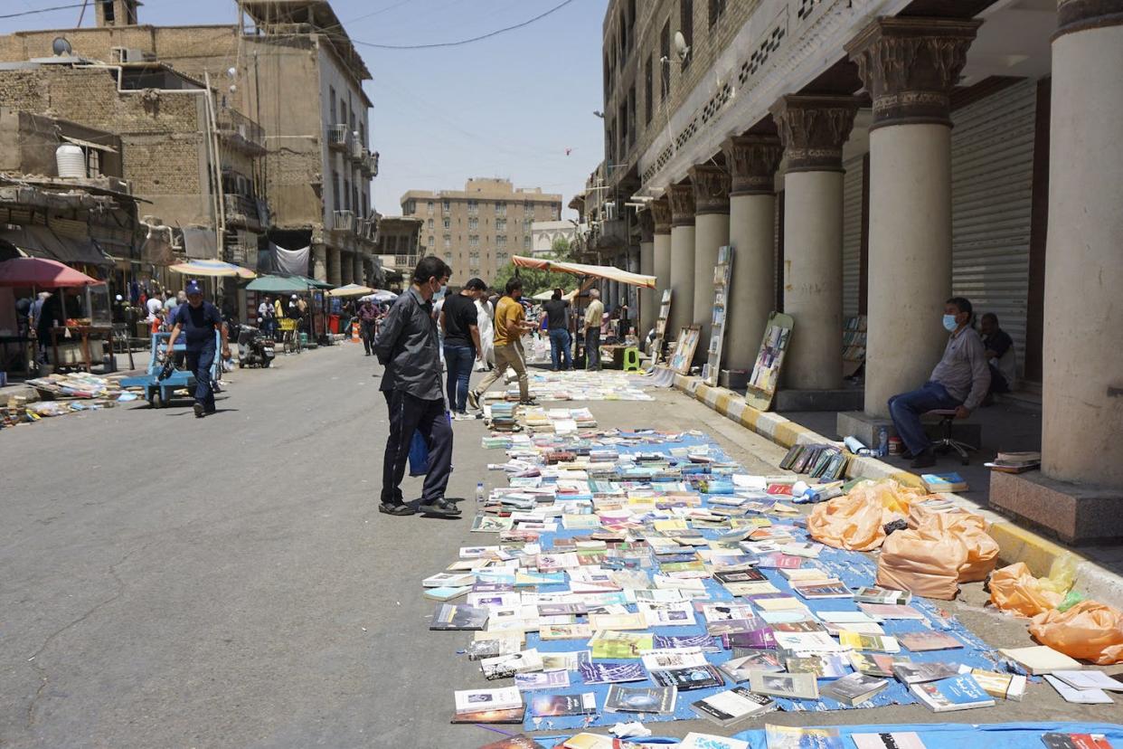 Iraqis shop in Baghdad's famous book market in July 2022. <a href="https://media.gettyimages.com/id/1241645580/photo/iraq-daily-life.jpg?s=1024x1024&w=gi&k=20&c=OQhTZ4qR5aPJyNaS_M-YkuDY40ockiWCrrwJ6g7wMyA=" rel="nofollow noopener" target="_blank" data-ylk="slk:Sabah Arar/AFP via Getty Images;elm:context_link;itc:0;sec:content-canvas" class="link ">Sabah Arar/AFP via Getty Images</a>