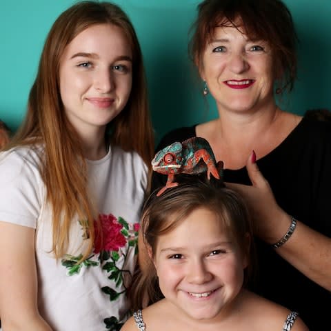 udith Woods and her daughters Lily, 16, and Tabitha, 9, with their pet chameleon - Credit: Clara Molden