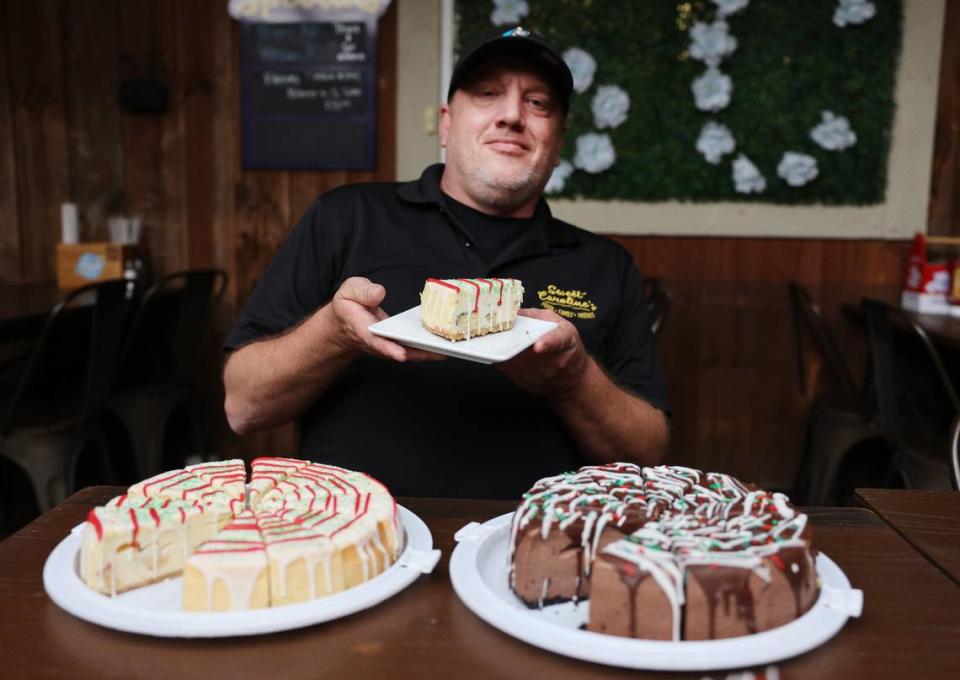 Steven Brousseau, manager of Sweet Caroline’s Restaurant in McConnells, S.C. holds a slice of the restaurant’s popular Little Debbie Christmas Tree cheesecake. A post about the cake went viral on Facebook.