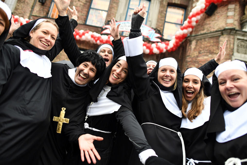 <p>Carnival revellers dressed as nuns celebrate the start of their hot season on Women’s Carnival, Feb. 23, 2017, in Duesseldorf, western Germany. (Photo: Federico Gambarini/AFP/Getty Images) </p>