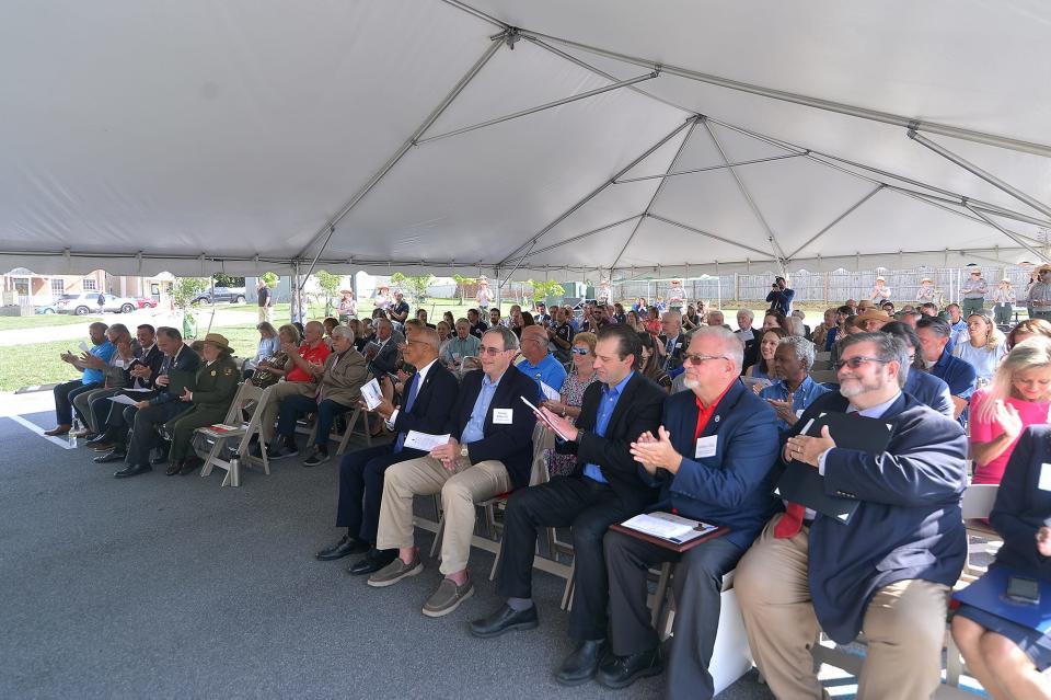 Local officials and members of the community attend a ribbon cutting ceremony Wednesday for the new C and O Canal headquarters in Williamsport.