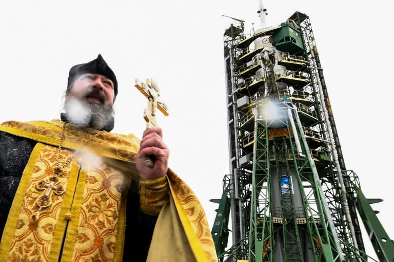 A Russian Orthodox priest conducts a blessing in front of the Soyuz MS-03 spacecraft set on the launch pad of the Russian-leased Baikonur cosmodrome in Kazakhstan on November 16, 2016