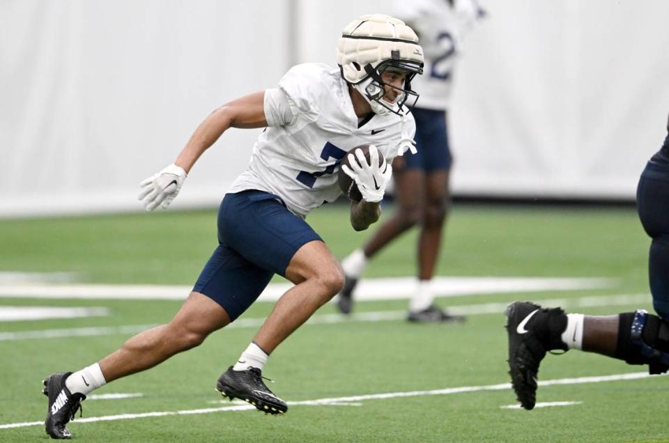 Penn State wide receiver Kaden Saunders makes a catch and runs down the field during practice on Sunday, Aug. 6, 2023.