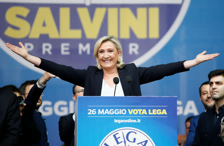 Marine Le Pen, leader of French National Rally party gestures as she addresses a major rally of European nationalist and far-right parties ahead of EU parliamentary elections in Milan, Italy May 18, 2019. REUTERS/Alessandro Garofalo