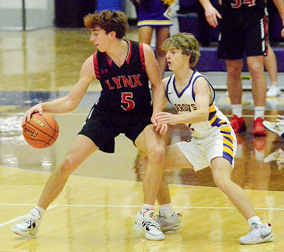 Watertown's Brody Torgerson (right) hounds Brandon Valley's Landon Dulaney during their Eastern South Dakota Conference boys basketball game Saturday in the Civic Arena. Brandon Valley won 62-50.