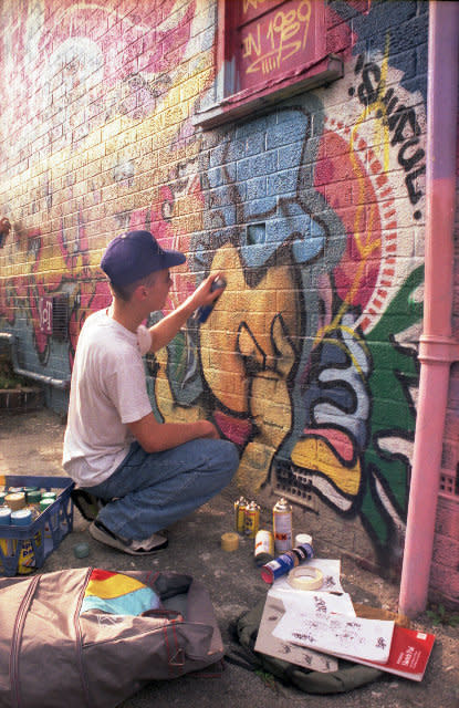 Street artist Cheo is pictured here painting at the Barton Hill Youth Centre in Bristol in 1989. (John Nation)