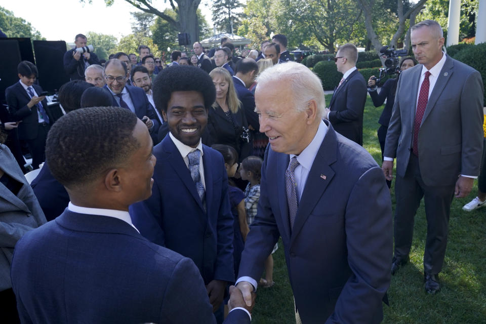 President Joe Biden greets people in the Rose Garden of the White House in Washington, Wednesday, Oct. 11, 2023, after speaking about efforts to eliminate hidden junk fees. The Federal Trade Commission on Wednesday proposed a rule to ban any hidden and bogus junk fees, which can mask the total cost of concert tickets, hotel rooms and utility bills. (AP Photo/Susan Walsh)
