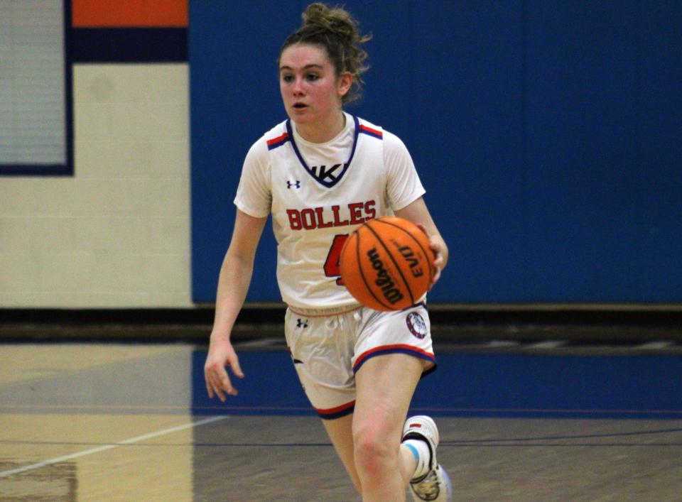 Bolles guard Ella Stakem (4) dribbles up the court during the Class 4A playoffs.