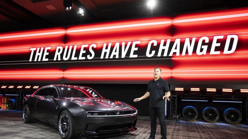 dodge ceo tim kuniskis with the dodge charger daytona ev