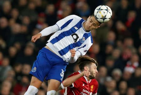 Soccer Football - Champions League Round of 16 Second Leg - Liverpool vs FC Porto - Anfield, Liverpool, Britain - March 6, 2018 Porto's Diogo Dalot in action with Liverpool's Adam Lallana REUTERS/Andrew Yates