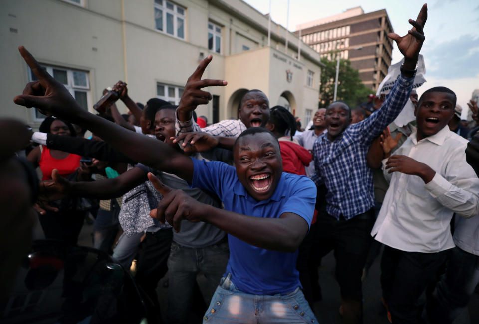 Zimbabweans celebrate in the capital city of Harare after President Robert Mugabe resigned on Nov. 21. (Photo: Mike Hutchings/Reuters)