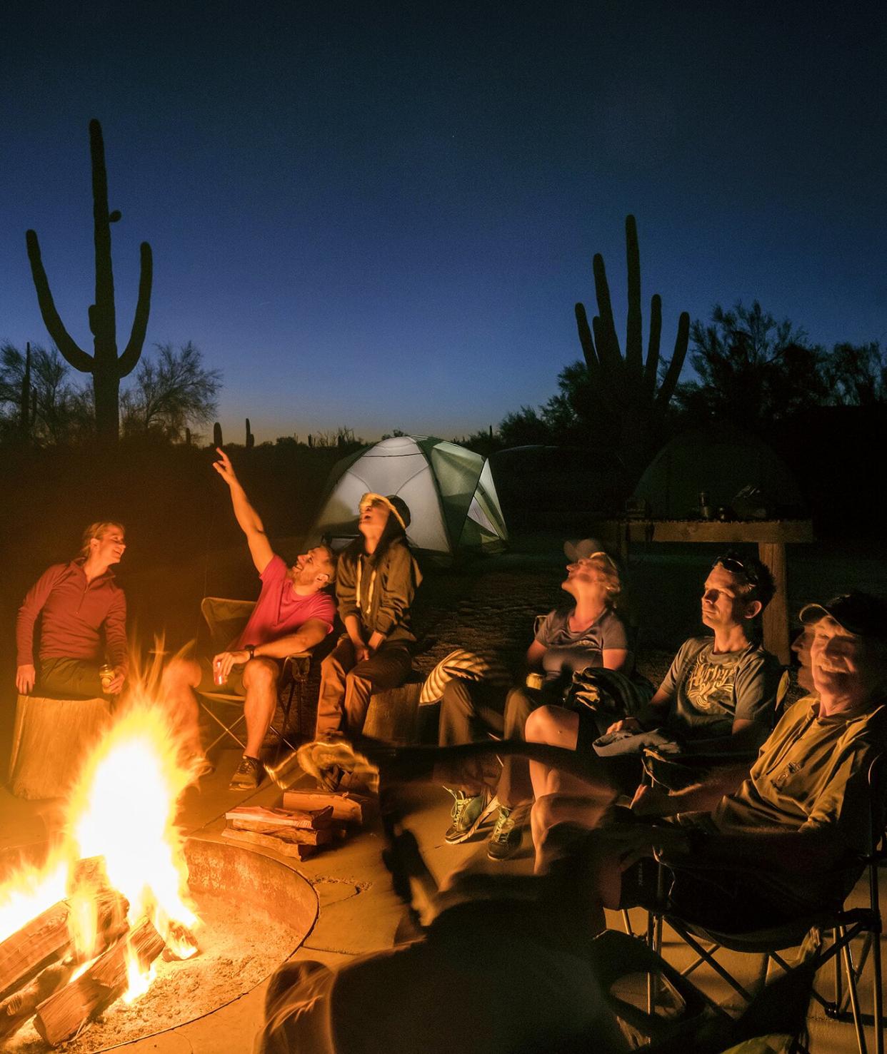 Group of people around campfire