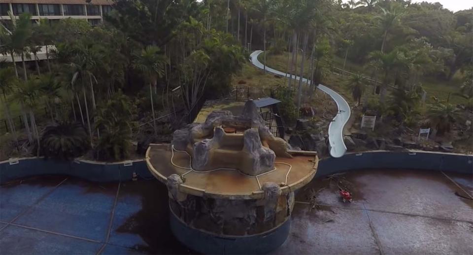 The abandoned swimming pool and water slide at the Capricorn Resort in Yeppoon.