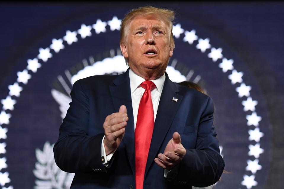 US President Donald Trump applauds as he attends Independence Day events at Mount Rushmore in Keystone, South Dakota, July 3, 2020. (Photo by SAUL LOEB / AFP) (Photo by SAUL LOEB/AFP via Getty Images)