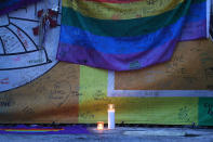 <p>A candle is displayed in the memorial set up outside the Pulse gay nightclub in memory of the victims of a mass shooting at the club one year ago on June 12, 2017 in Orlando, Florida. (Joe Raedle/Getty Images) </p>