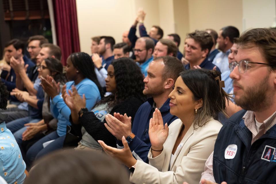 Supporters of the Titans stadium applaud  following the vote during Nashville's Metro Council meeting, regarding a proposed $2.1 billion deal to build a new, enclosed Tennessee Titans stadium at  the Historic Metro Courthouse in Nashville , Tenn., Tuesday, April 25, 2023.