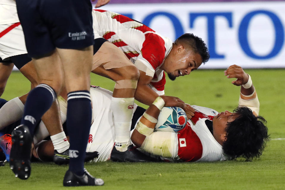 Japan's Keita Inagaki scores a try during the Rugby World Cup Pool A game at International Stadium between Japan and Scotland in Yokohama, Japan, Sunday, Oct. 13, 2019. (AP Photo/Eugene Hoshiko)