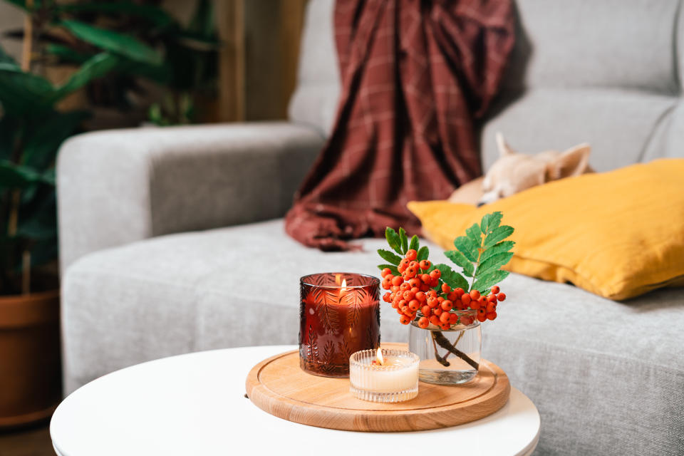 candles burning with dog sleeping in the background