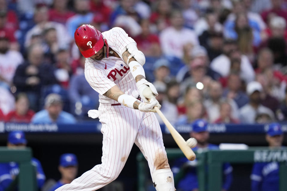 Philadelphia Phillies' Nick Castellanos hits a two-run home run against Toronto Blue Jays starting pitcher Alek Manoah during the fourth inning of a baseball game, Tuesday, May 9, 2023, in Philadelphia. (AP Photo/Matt Slocum)