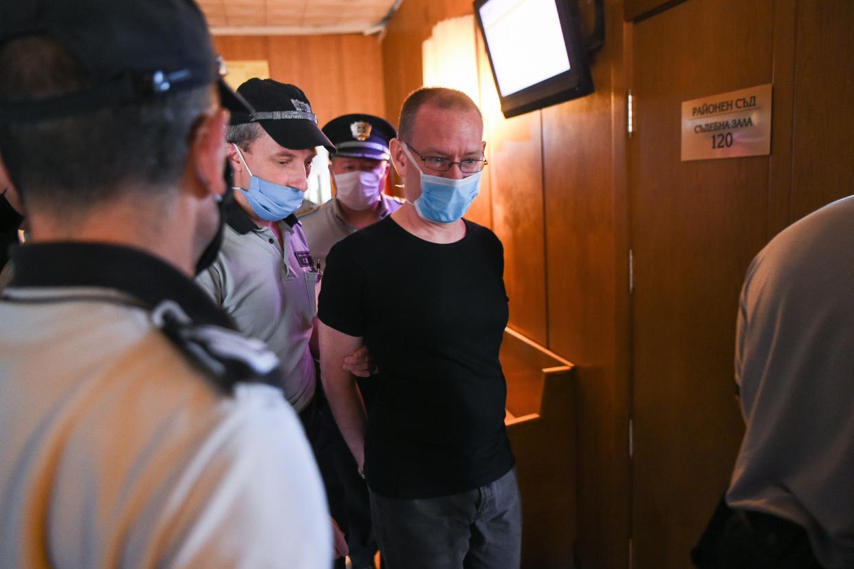British suspect Daniel Erickson-Hull (1st-R) is escorted into court in the city of Sliven, on July 17, 2020. - The trial of a British man convicted in the UK of possessing child pornography opened in Bulgaria Friday on charges of sexually abusing eight underage boys in a poor Roma community. Their families have refused to press for civil damages, however. Daniel Erickson-Hull, 44, was detained last September in the central town of Sliven, where he was a self-proclaimed evangelical preacher. (Photo by NIKOLAY DOYCHINOV / AFP) (Photo by NIKOLAY DOYCHINOV/AFP via Getty Images)