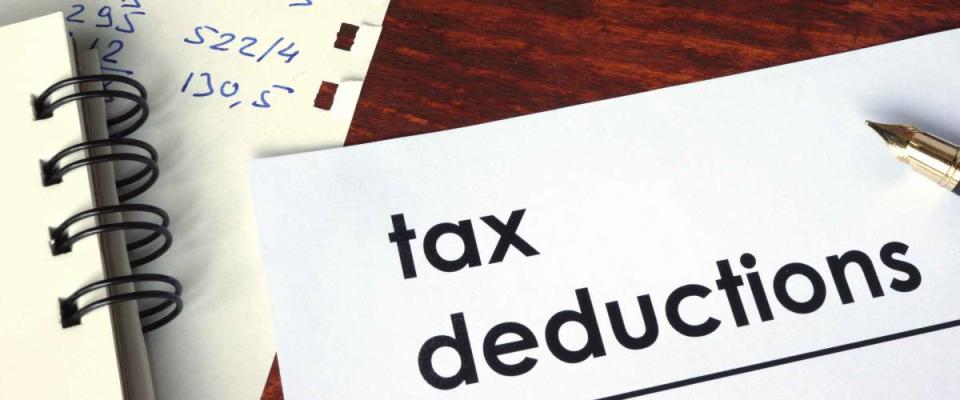 Tax deductions written on a paper.