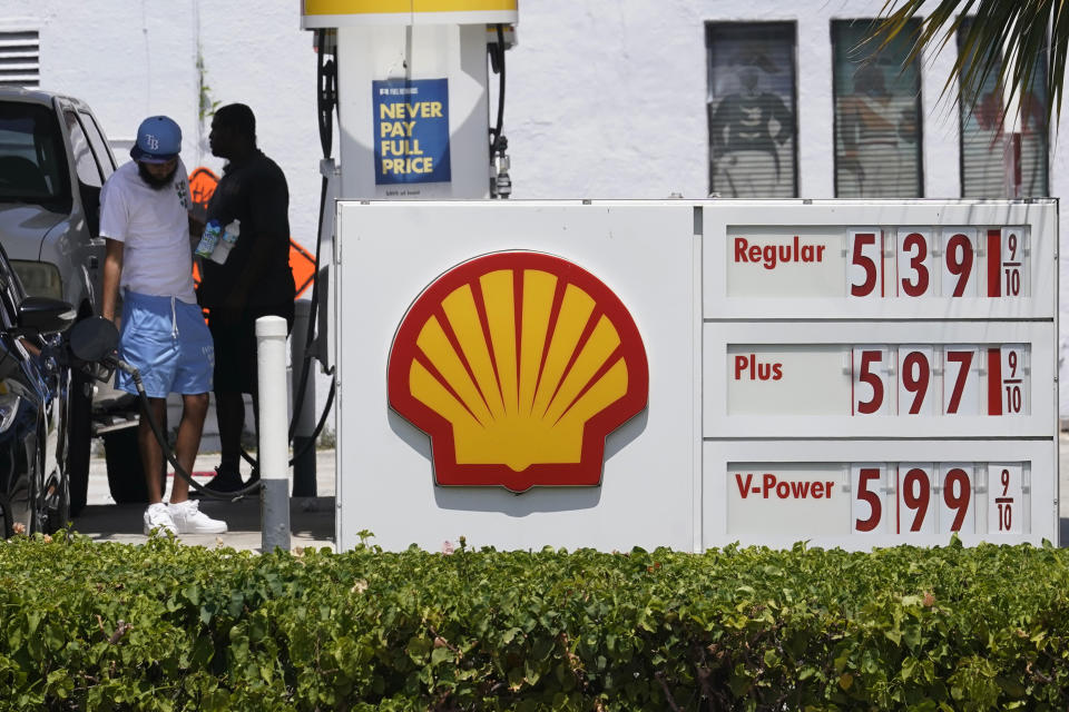 Consumers fill up at a Shell gas station Wednesday, July 13, 2022, in Miami Beach, Fla. Consumer prices soared 9.1% compared with a year earlier, the biggest yearly increase since 1981. (AP Photo/Marta Lavandier)