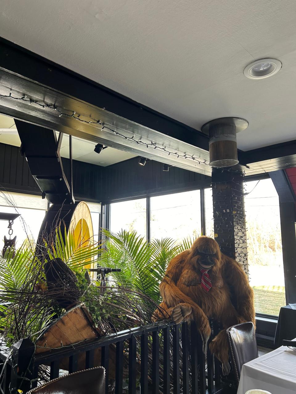 Annabel the Orangutan sits perched on a railing surrounding Yarmouth House's famous water wheel.