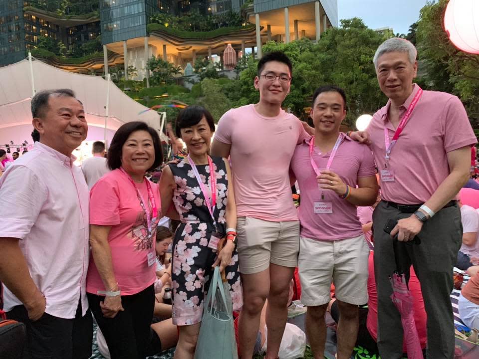 Lee Hsien Yang (extreme right), his wife Lee Suet Fern (third from left) and their son Li Huanwu (third from right) attended Pink Dot 2019 on 29 June 2019 at Hong Lim Park along with Li's husband Heng Yirui (second from right) and Heng's parents (first and second from left). PHOTO: Pink Dot SG/Facebook