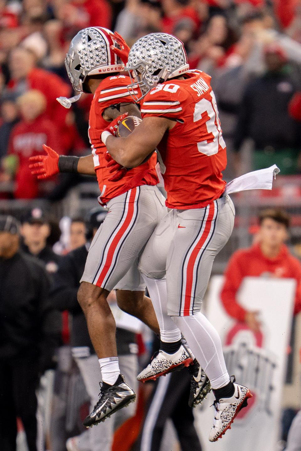 Nov 18, 2023; Columbus, Ohio, USA; 
Ohio State Buckeyes linebacker Cody Simon (30) and Ohio State Buckeyes linebacker C.J. Hicks (11) celebrate a defensive stop during the first half of their game against Minnesota Golden Gophers on Saturday, Nov. 18, 2023 at Ohio Stadium.