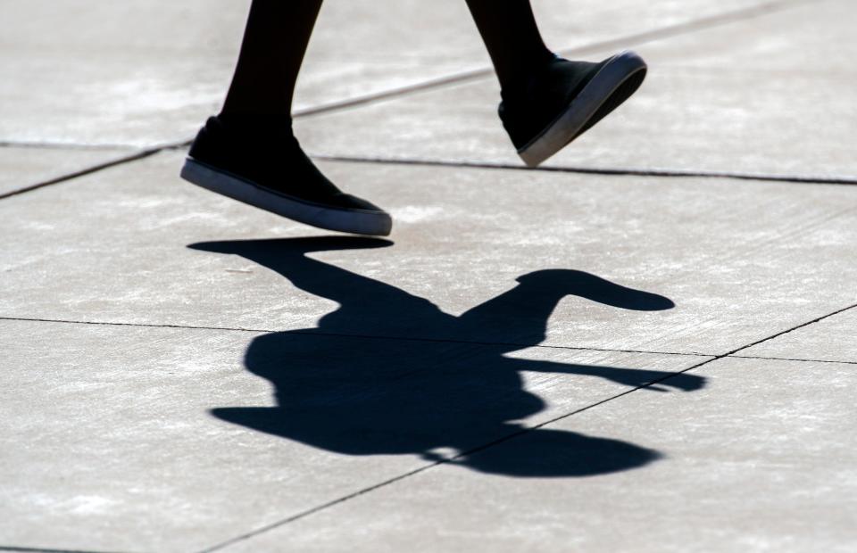 Eleven-year-old St. Seth Yarbrough casts a shadow while participating in a free Zumba class during the Family Wellness Jam outside of the Dorothy L. Jones Community Center in south Stockton on Saturday, Sept. 18, 2021. 