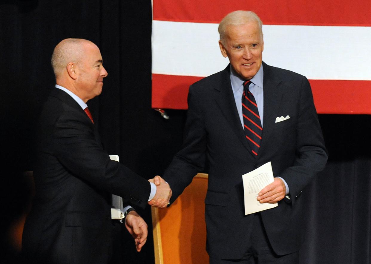 Alejandro Mayorkas and then-Vice President Joe Biden attend a naturalization ceremony at Martin Luther King, Jr. Center on November 14, 2013 in Atlanta, Georgia.  (Chris McKay/WireImage)