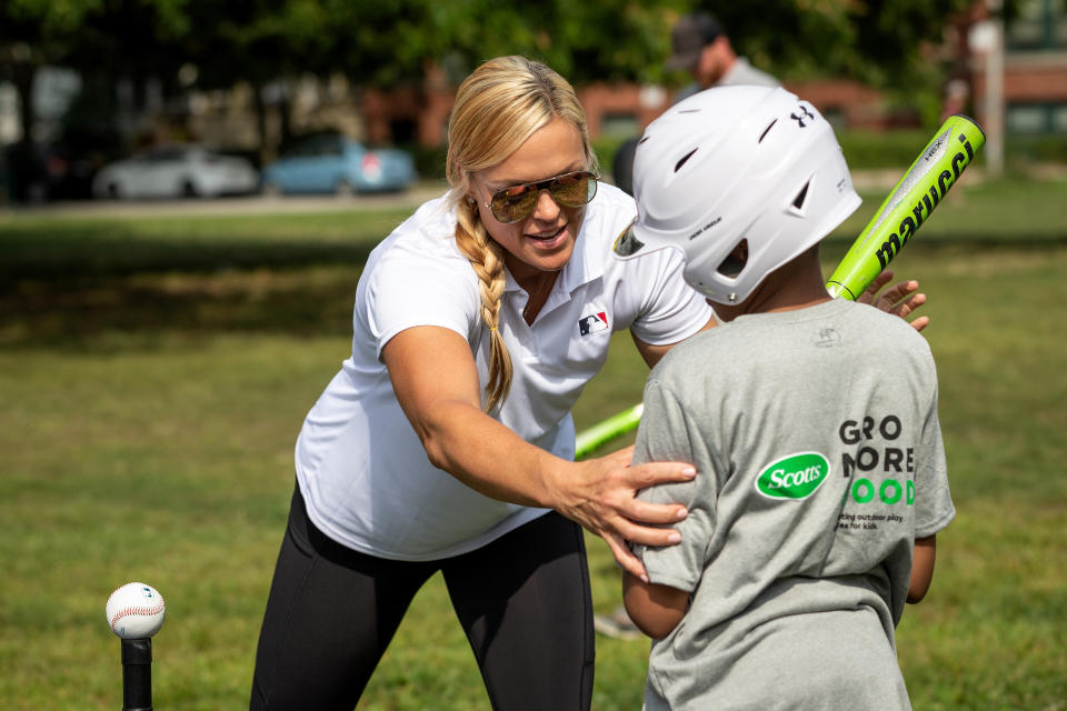 Jennie Finch gives hitting tips to a student from Ray Elementary. (Photo by Dylan Buell/MLB Photos via Getty Images)