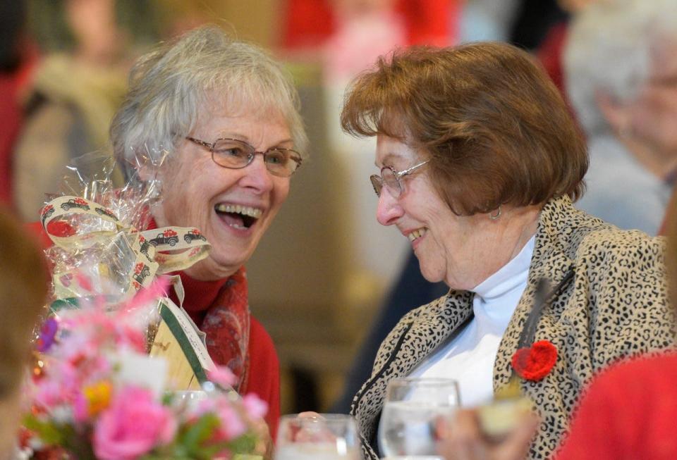 Barbara Kahler of Catawba, left, and Sue Stevens of Catawba enjoy a fun moment during the Port Clinton Area Valentine’s Day Widows Luncheon on Feb. 14.