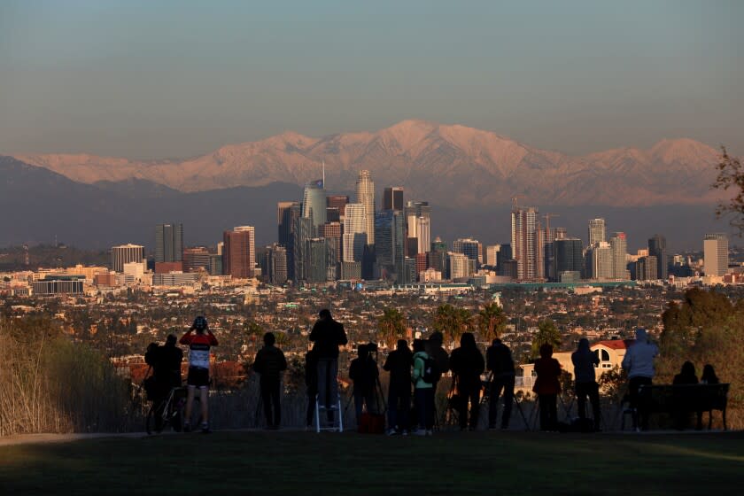 LOS ANGELES, CALIF. -- FRIDAY, DECEMBER 27, 2019: Downtown Los Angeles with the San Gabriel mountains shown in the background taken from Kenneth Hahn State Recreation Area in Los Angeles, Calif., on Dec. 27, 2019. (Gary Coronado / Los Angeles Times)