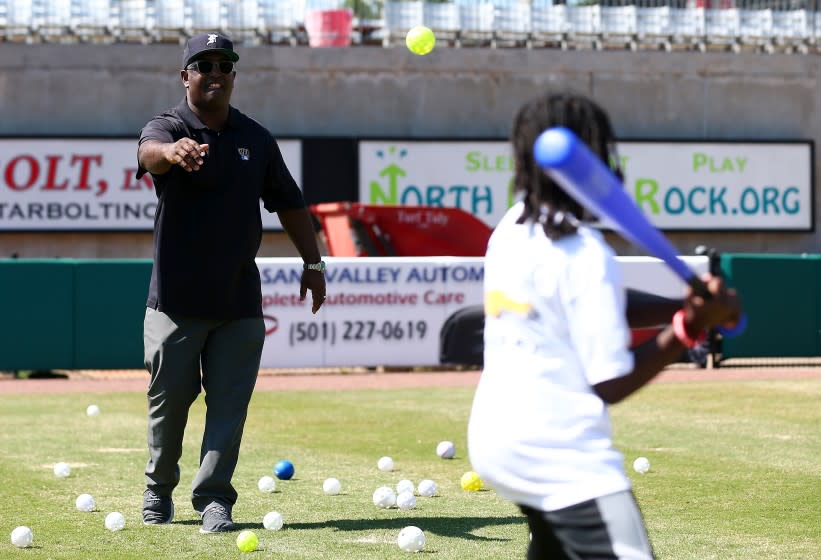 Tony Reagins coaches children during a 2018 MLB event in North Little Rock, Ark.