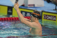 Nic Fink celebrates after winning the men's 50-meter breaststroke event at the U.S. nationals swimming meet in Indianapolis, Thursday, June 29, 2023. (AP Photo/Michael Conroy)