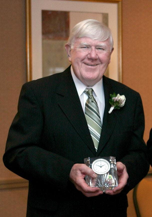 Former Framingham athletic director Jim O'Connor poses with his award prior to the "Salute to Framingham" dinner at the Sheraton in Framingham in 2007.