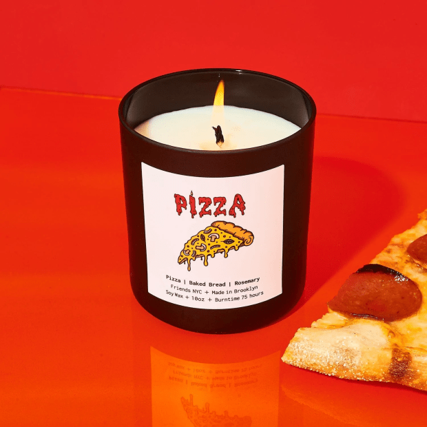 Friends NYC Pizza Candle, $34.99, <a href="https://friendsnyc.com/collections/new/products/friends-boxed-jar-candle-10-oz-pizza-scented" rel="nofollow noopener" target="_blank" data-ylk="slk:available here;elm:context_link;itc:0;sec:content-canvas" class="link ">available here</a>.<p>Photo: Courtesy of Friends NYC</p>