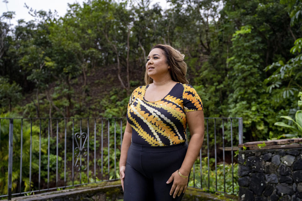 Mailani Makainai, great-great-granddaughter of Hamana Kalili who is known as the father of shaka, poses for a portrait at her home on Wednesday, March 6, 2024, in Kaneohe, Hawaii. (AP Photo/Mengshin Lin)