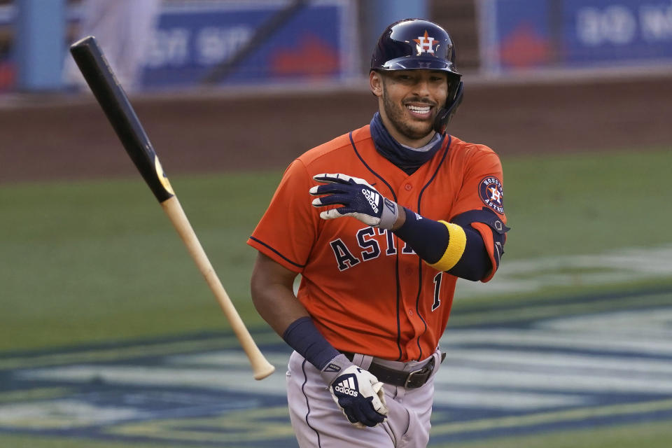 FILE - Houston Astros' Carlos Correa smiles after drawing a walk against the Oakland Athletics during the ninth inning of Game 2 of a baseball American League Division Series in Los Angeles, in this Tuesday, Oct. 6, 2020, file photo. Correa is among roughly 125 players who entered Friday, Jan. 15, 2021, eligible to exchange salary arbitration figures with their teams.(AP Photo/Ashley Landis, File)