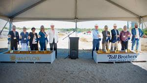 From left: Lewisville Deputy Mayor Pro Tem William J. Meridith, Lewisville Planning and Zoning Commissioner Karen Locke, Lewisville Councilwoman Ronni Cade, Lewisville City Manager Claire Powell, Lewisville Mayor TJ Gilmore, The Davis Companies Vice President of Development Joint Ventures Chris Lasky, Lewisville ISD Board Member Dr. Buddy Bonner, Toll Brothers Apartment Living Texas Regional Director Tommy Rhodus, Lewisville Councilman Bob Troyer, and Lewisville Planning and Zoning Commissioner Robert French.