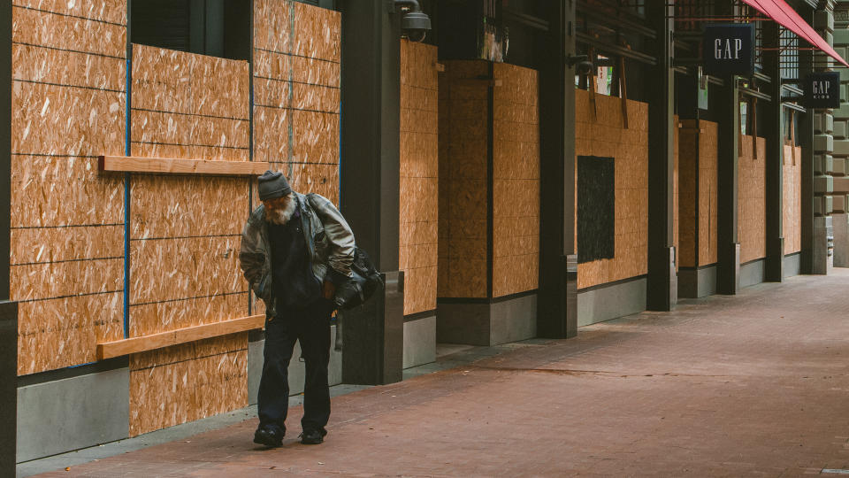 San Francisco, California - April 5th, 2020: Boarded up storefronts and for rent signs have replaced crowds of shoppers in downtown San Francisco during the Covid-19 crisis.