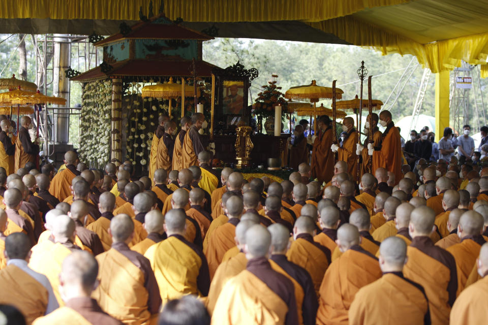 Buddhist monks attend the cremation of Vietnamese Buddhist monk Thich Nhat Hanh in Hue, Vietnam Saturday, Jan. 29, 2022. A funeral was held Saturday for Thich Nhat Hanh, a week after the renowned Zen master died at the age of 95 in Hue in central Vietnam. (AP Photo/Thanh Vo)