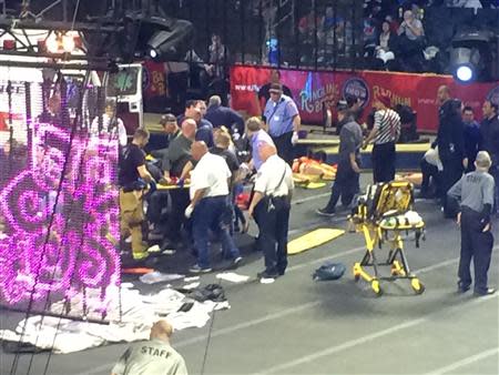 Emergency personnel attend to Ringling Bros. and Barnum & Bailey Circus performers who were injured when the scaffolding they were performing from collapsed in Providence, Rhode Island, May 4, 2014. REUTERS/Aletha Wood