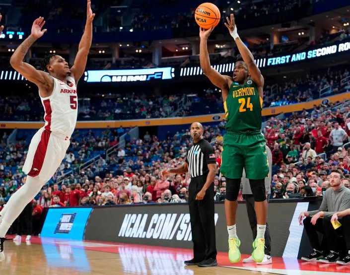 Mar 17, 2022; Buffalo, NY, USA; Vermont Catamounts guard Ben Shungu (24) shoots over Arkansas Razorbacks guard Au&#39;Diese Toney (5) in the second half during the first round of the 2022 NCAA Tournament at KeyBank Center. Mandatory Credit: Gregory Fisher-USA TODAY Sports