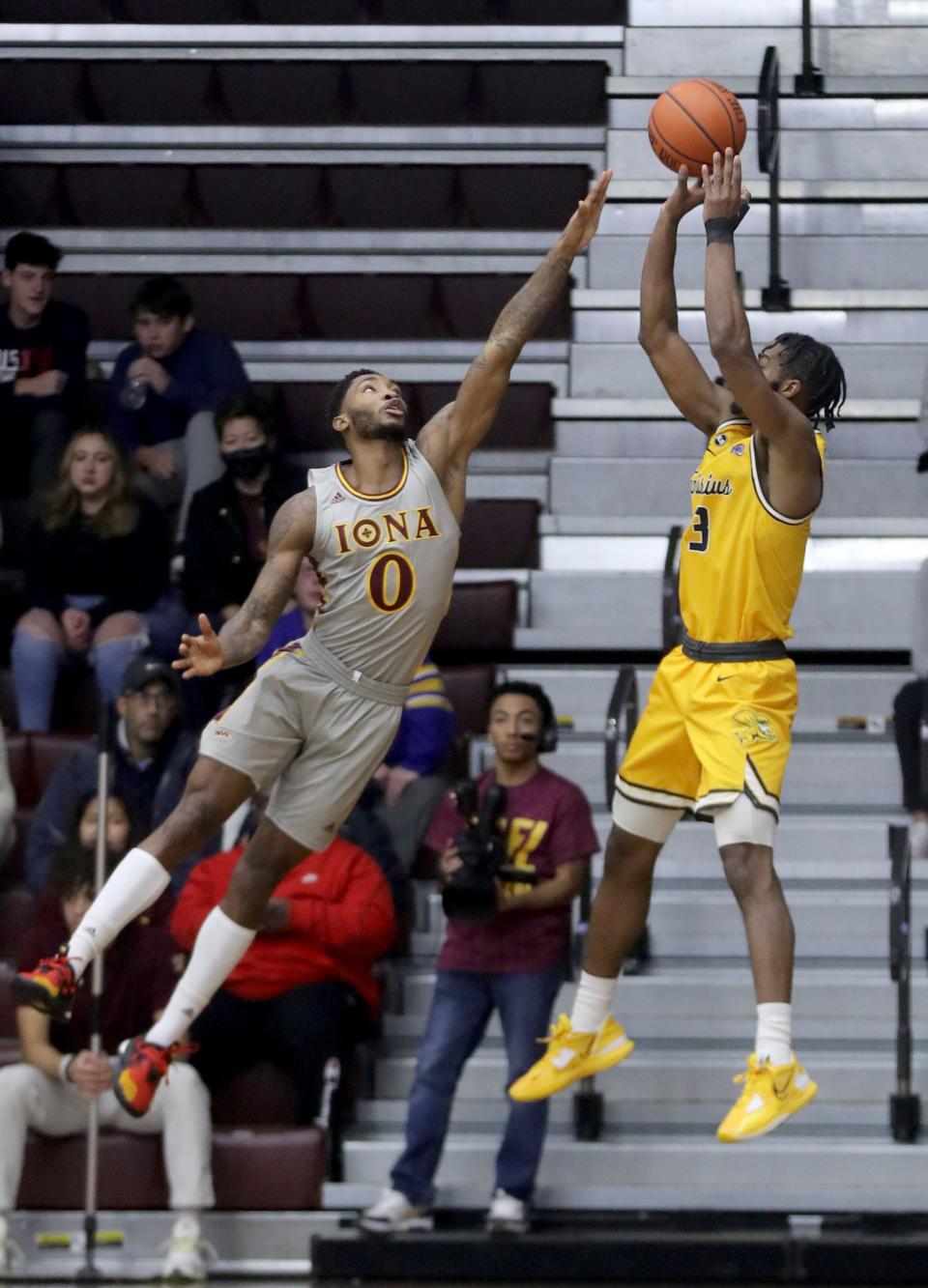 Berrick JeanLouis of Iona defends against Jordan Henderson of Canisius during a MAAC basketball game at Iona University in New Rochelle Dec. 4, 2022. Iona defeated Canisius 90-60.