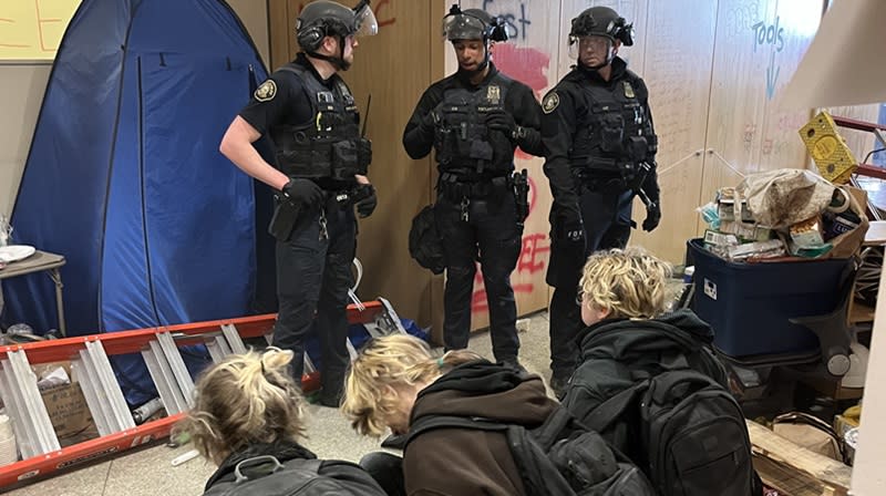 Three of the dozens of people arrested after occupying the Millar Library on the campus of Portland State University, May 2, 2024 (PPB)