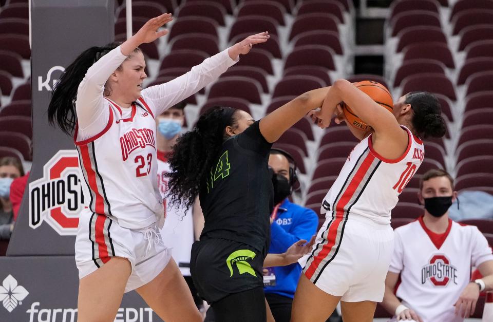 Michigan State's Taiyier Parks, middle, is joining the Ohio State after battling the Buckeyes four times during her college career.